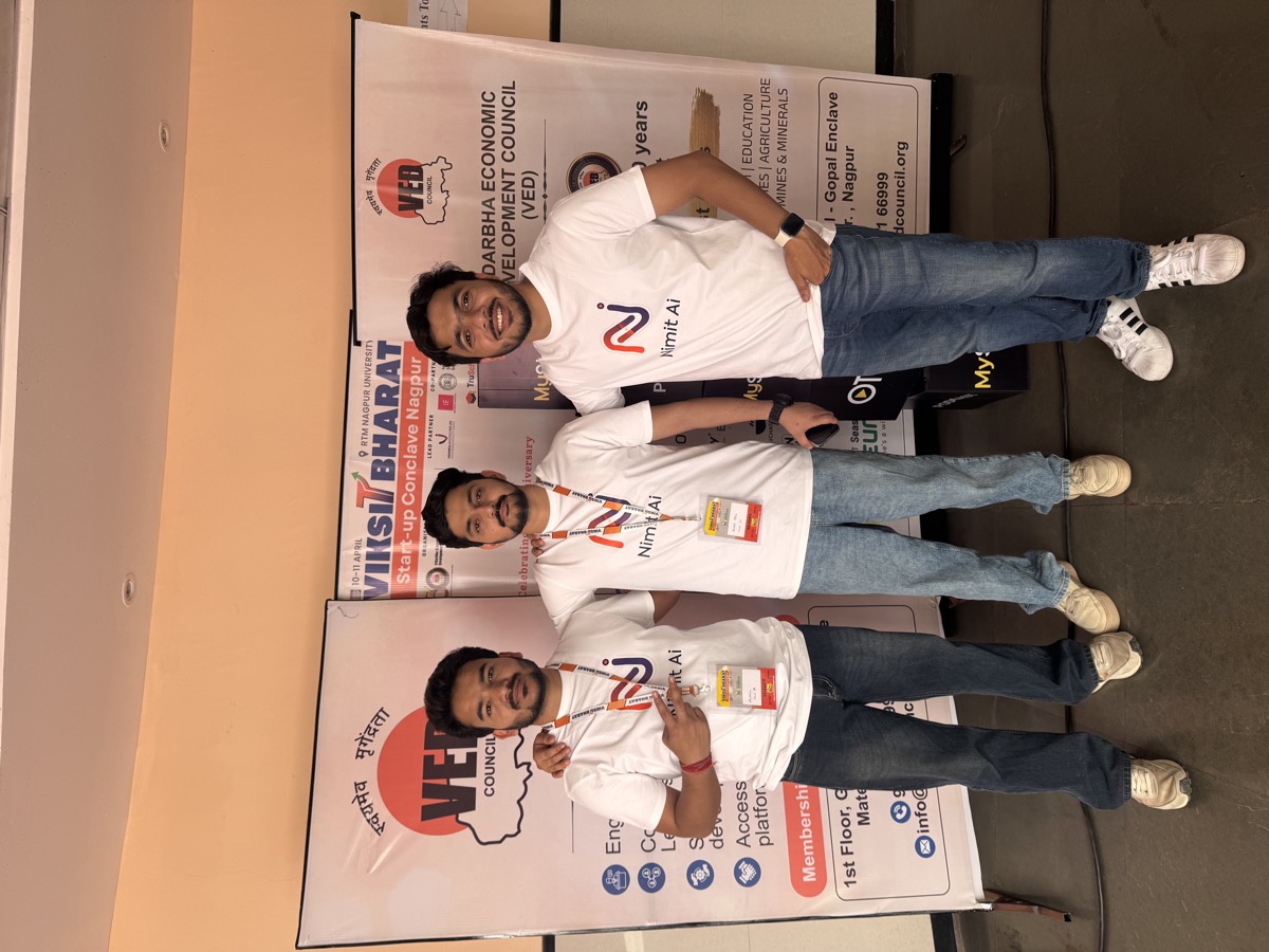Nilansh, Archit, and Shubham in front of Lemon Ideas and VED Council standee at Innopreneurs Season 12 Nagpur