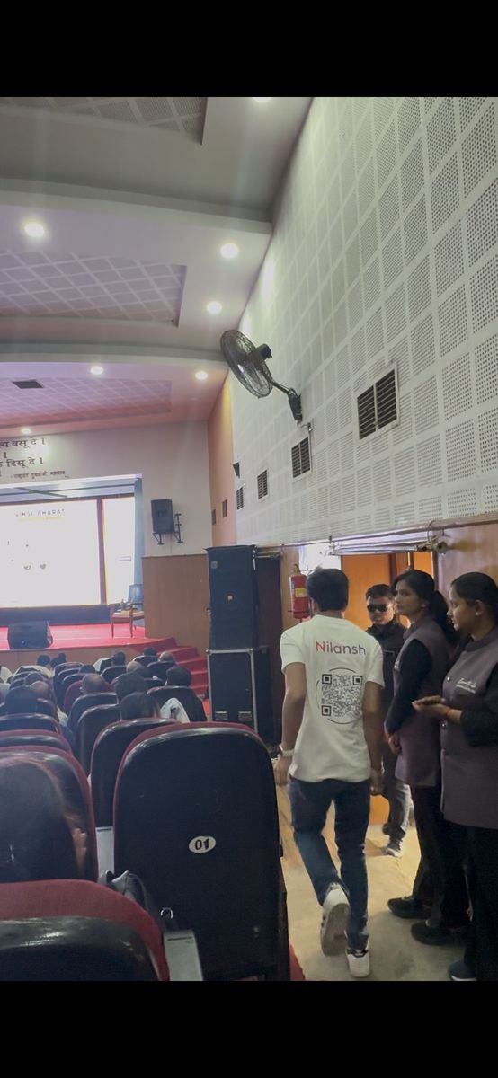 Nilansh walking toward the stage at RTMNU Nagpur auditorium for Innopreneurs Season 12 pitch