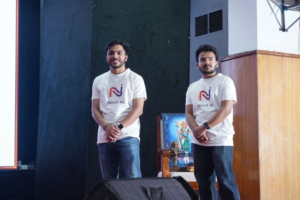 Nilansh Gupta and Archit Dhir on stage at Innopreneurs Season 12 Viksit Bharat Conclave Nagpur wearing Nimitai branded t-shirts